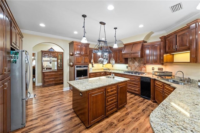 7180 Cannon Ball Cir, Bay Minette, AL 36507 - kitchen with visible vents, ornamental molding, arched walkways, a sink, and appliances with stainless steel finishes