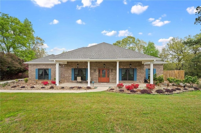 7180 Cannon Ball Cir, Bay Minette, AL 36507 - back of property with fence, a yard, a porch, and brick siding