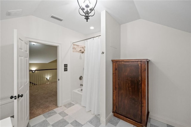 7180 Cannon Ball Cir, Bay Minette, AL 36507 - bathroom with baseboards, shower / bath combination with curtain, vaulted ceiling, and visible vents