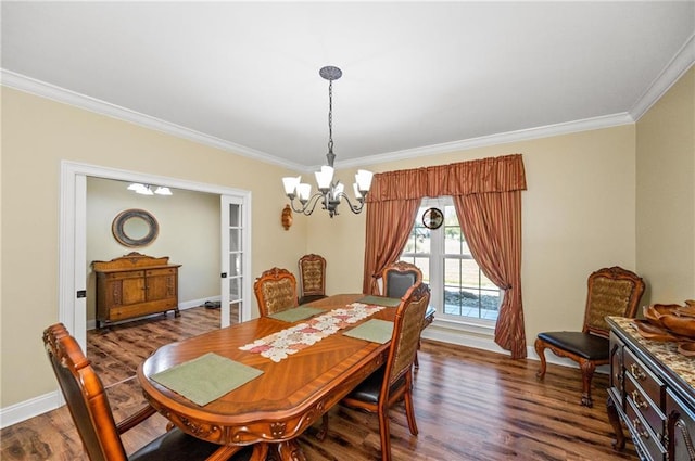 7180 Cannon Ball Cir, Bay Minette, AL 36507 - dining space featuring crown molding, baseboards, a notable chandelier, and dark wood finished floors