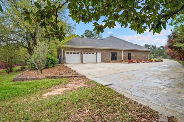 7180 Cannon Ball Cir, Bay Minette, AL 36507 - view of side of home featuring brick siding, an attached garage, and driveway