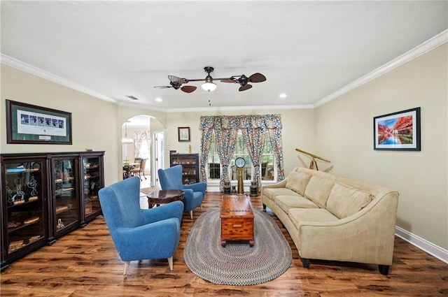 7180 Cannon Ball Cir, Bay Minette, AL 36507 - living area with ornamental molding, wood finished floors, ceiling fan, plenty of natural light, and arched walkways