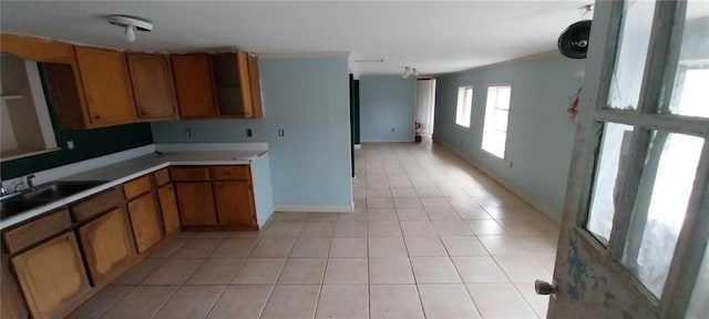 kitchen featuring light tile patterned flooring and sink