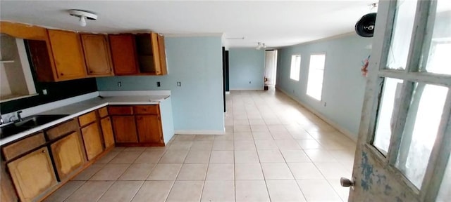 kitchen with light tile patterned flooring and sink