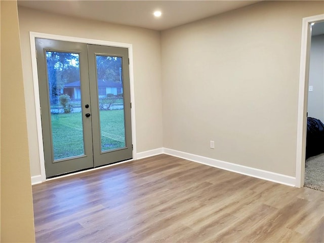 doorway to outside with french doors and light hardwood / wood-style flooring