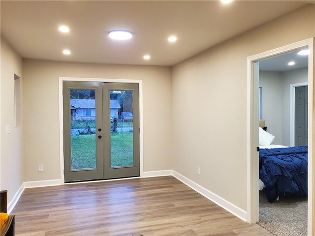 doorway to outside featuring light wood-type flooring and french doors