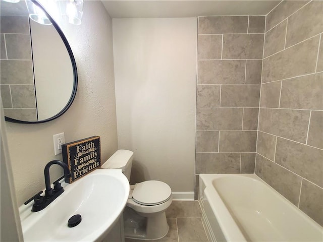 full bathroom with toilet, sink, tiled shower / bath combo, and tile patterned flooring