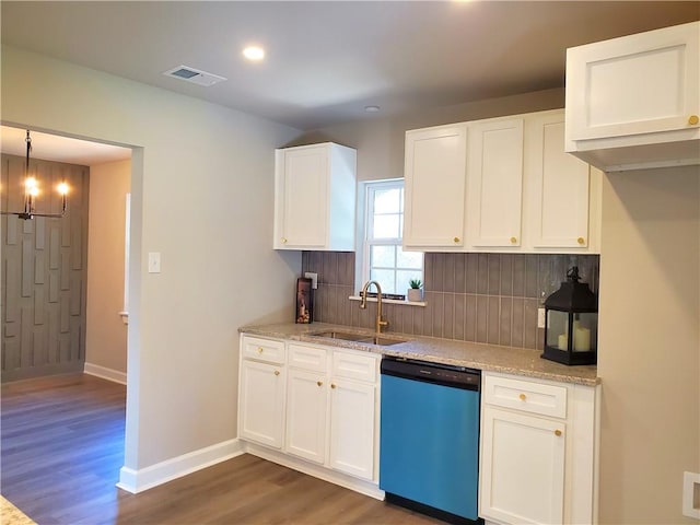 kitchen with white cabinetry, sink, hanging light fixtures, stainless steel dishwasher, and dark hardwood / wood-style floors