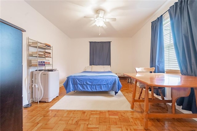 bedroom featuring light parquet flooring and ceiling fan