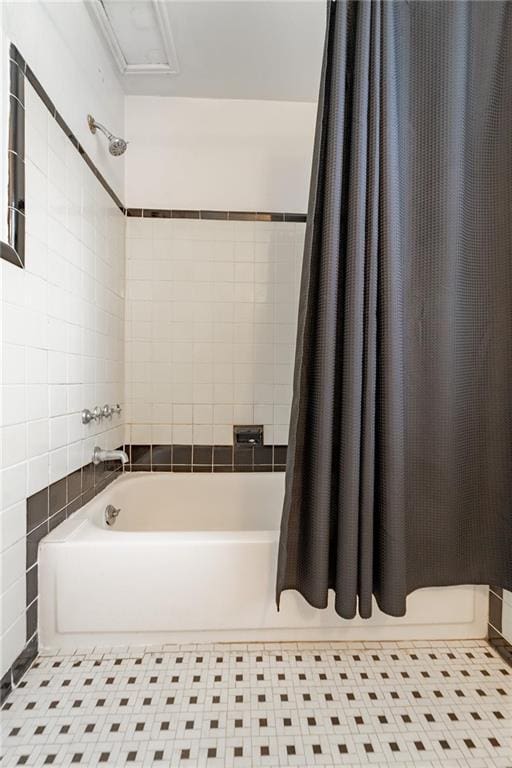 bathroom featuring shower / tub combo with curtain