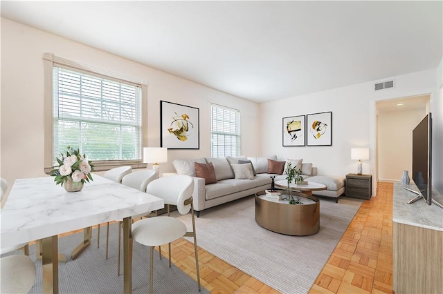 living room featuring parquet flooring