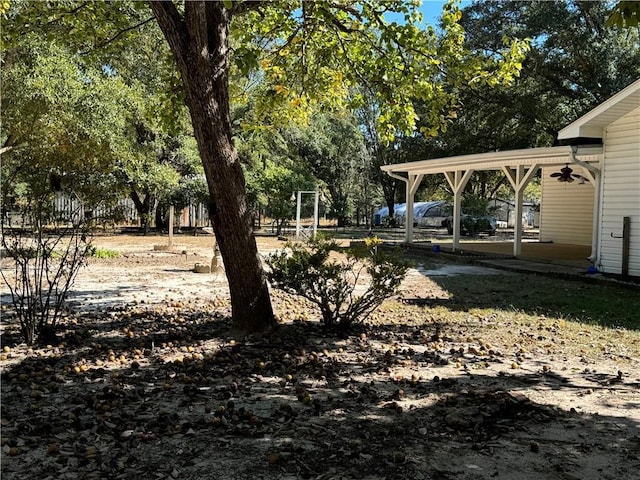 view of yard with a patio area and ceiling fan