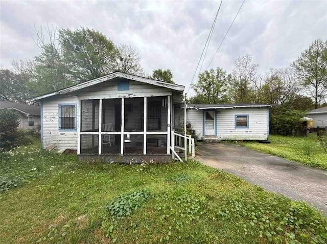 1320 Jessie St, Mobile, AL 36617 - view of front of property with a front lawn and a sunroom