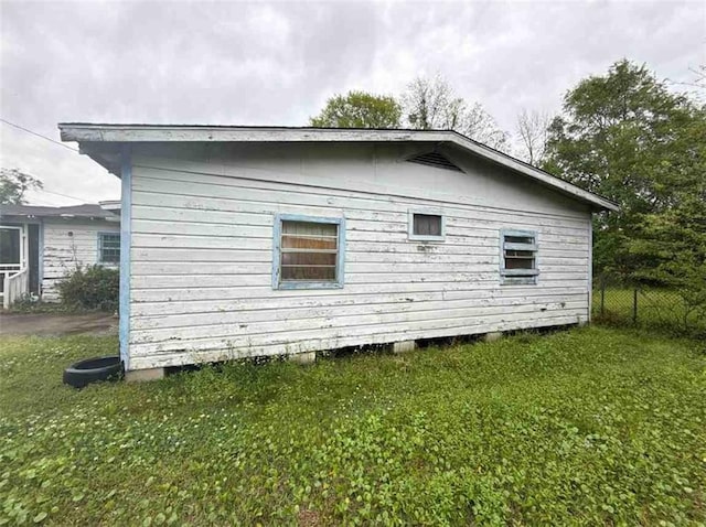 1320 Jessie St, Mobile, AL 36617 - view of side of property featuring a yard and fence
