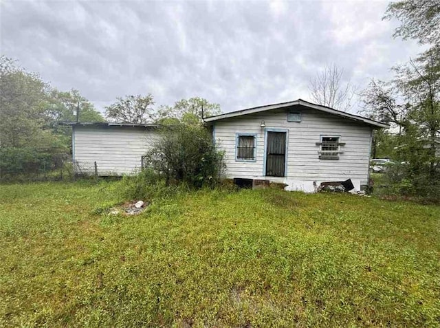 1320 Jessie St, Mobile, AL 36617 - rear view of house with a lawn