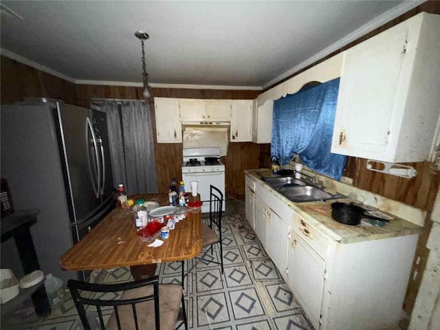 1320 Jessie St, Mobile, AL 36617 - kitchen with a sink, freestanding refrigerator, crown molding, white cabinetry, and white gas range