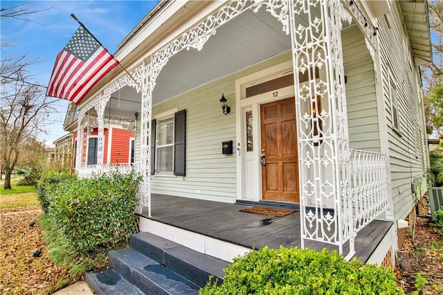 view of exterior entry featuring a porch