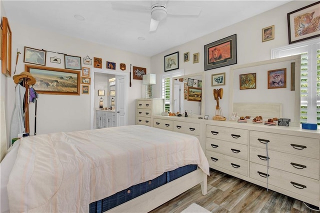 908 Longfellow Pl, Dauphin Island, AL 36528 - bedroom with multiple windows, wood finished floors, ceiling fan, and ensuite bathroom