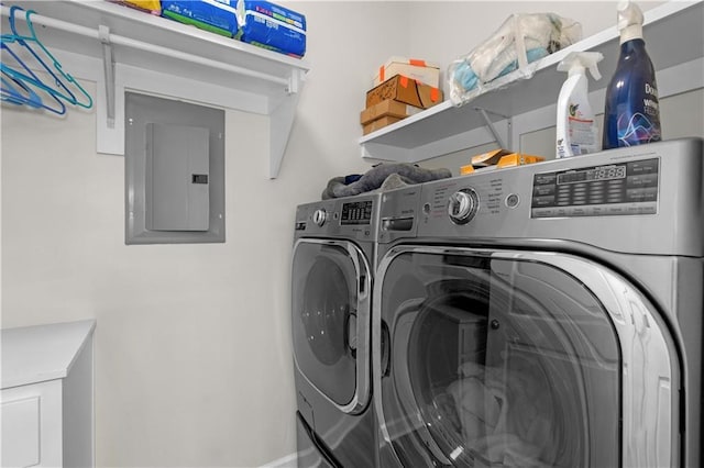 908 Longfellow Pl, Dauphin Island, AL 36528 - laundry room featuring independent washer and dryer, electric panel, and baseboards