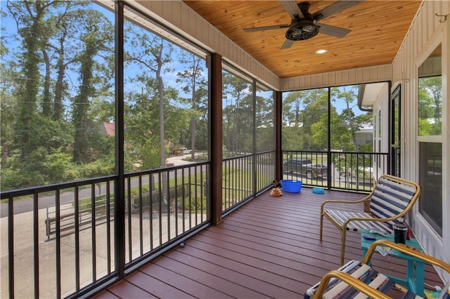 908 Longfellow Pl, Dauphin Island, AL 36528 - sunroom / solarium featuring a ceiling fan and view of scattered trees
