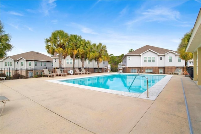 view of swimming pool with a patio