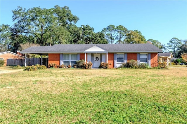 single story home featuring a carport and a front lawn