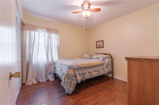 bedroom featuring ceiling fan and dark hardwood / wood-style flooring