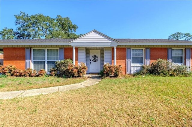 single story home featuring a front yard