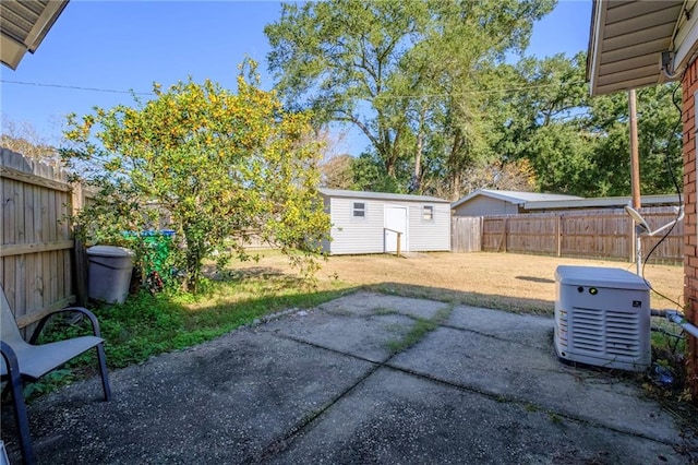 view of yard with a storage unit and a patio area