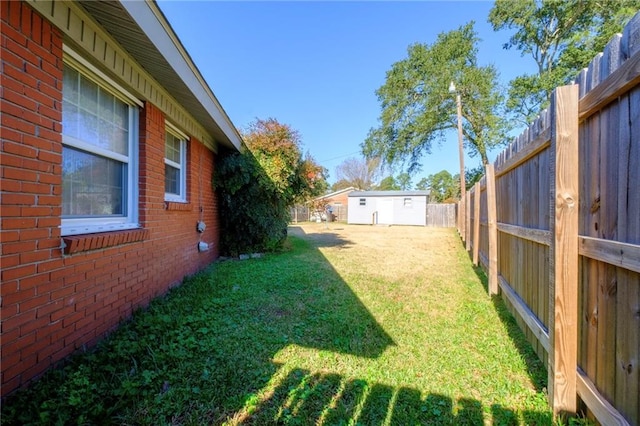 view of yard with a storage unit