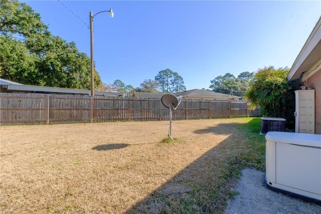 view of yard with central AC unit