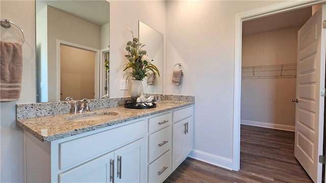 bathroom featuring vanity and hardwood / wood-style flooring