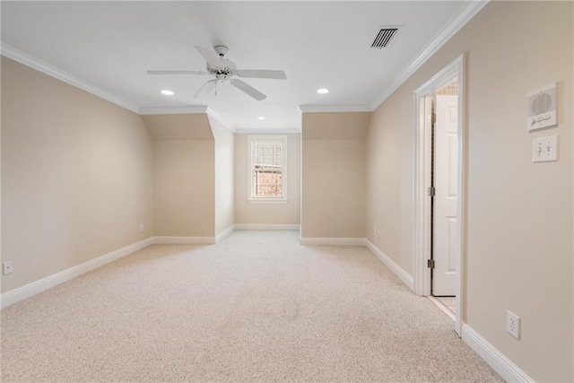 unfurnished room with ornamental molding, ceiling fan, and light colored carpet