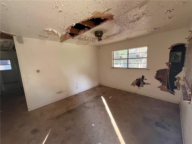 empty room with a textured ceiling