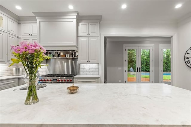 4008 Mcgregor Oaks, Mobile, AL 36608 - kitchen with recessed lighting, light stone counters, french doors, backsplash, and stainless steel range oven