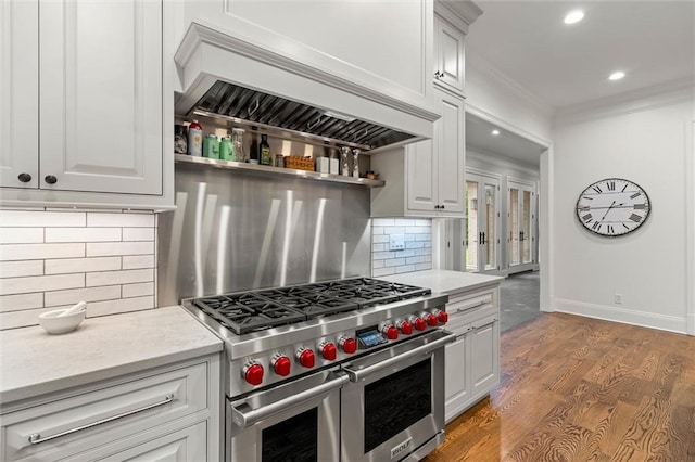 4008 Mcgregor Oaks, Mobile, AL 36608 - kitchen featuring double oven range, custom exhaust hood, ornamental molding, light countertops, and tasteful backsplash