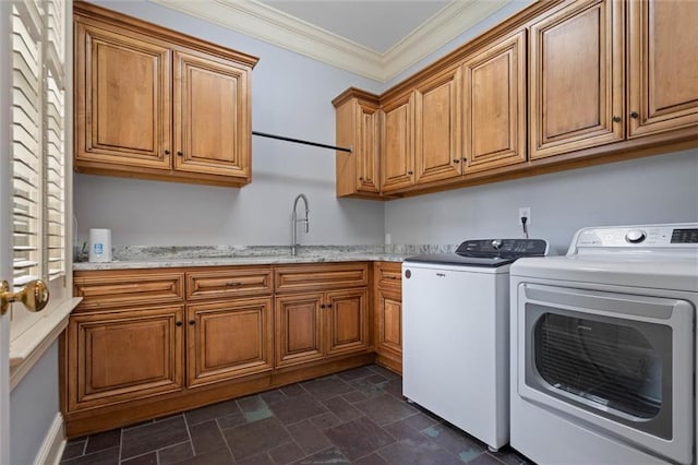 4008 Mcgregor Oaks, Mobile, AL 36608 - washroom featuring cabinet space, washer and dryer, dark stone finish flooring, and ornamental molding