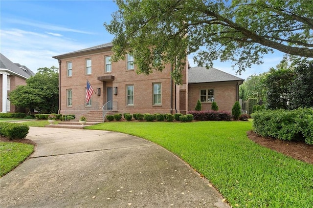 4008 Mcgregor Oaks, Mobile, AL 36608 - view of front facade featuring a front yard and brick siding