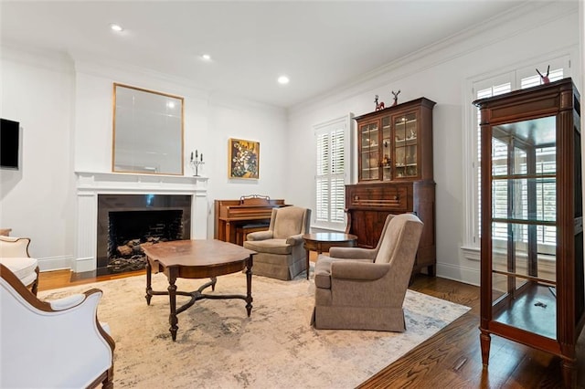 4008 Mcgregor Oaks, Mobile, AL 36608 - living area with crown molding, wood finished floors, plenty of natural light, a fireplace, and recessed lighting