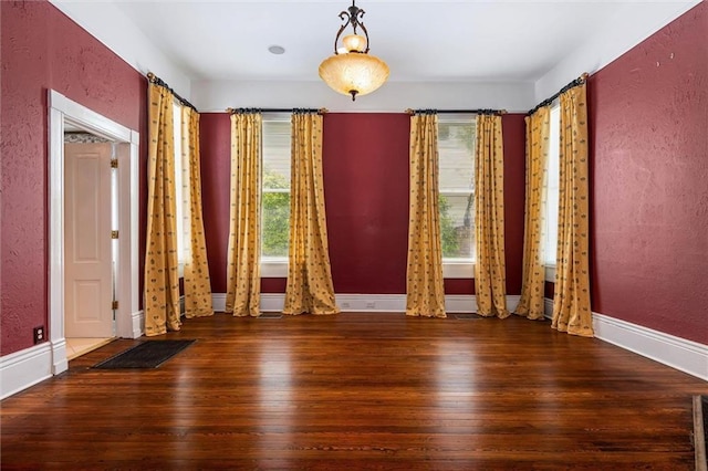 251 Georgia Ave S, Mobile, AL 36604 - spare room featuring a textured wall, a healthy amount of sunlight, and hardwood / wood-style floors