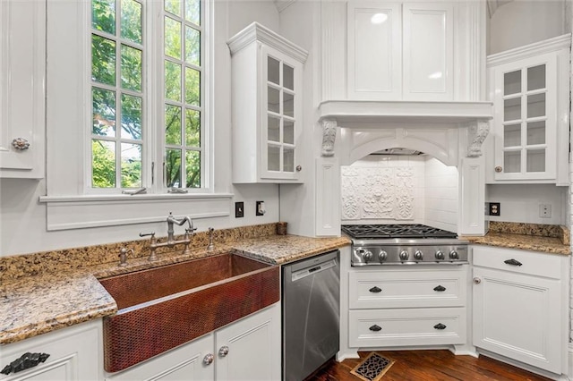 251 Georgia Ave S, Mobile, AL 36604 - kitchen with glass insert cabinets, appliances with stainless steel finishes, white cabinetry, custom range hood, and dark wood-style flooring
