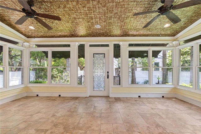 251 Georgia Ave S, Mobile, AL 36604 - unfurnished sunroom with stone tile floors, ornamental molding, and a healthy amount of sunlight
