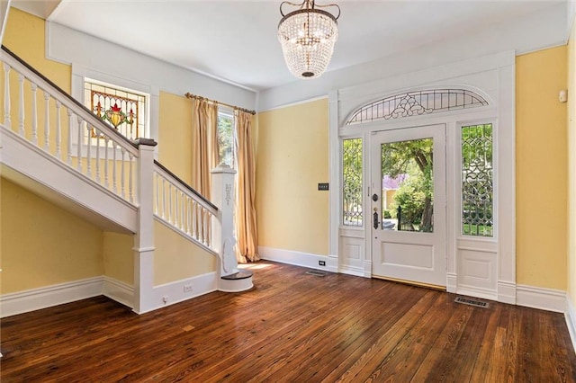 251 Georgia Ave S, Mobile, AL 36604 - foyer featuring stairs, a chandelier, wood-type flooring, baseboards, and visible vents