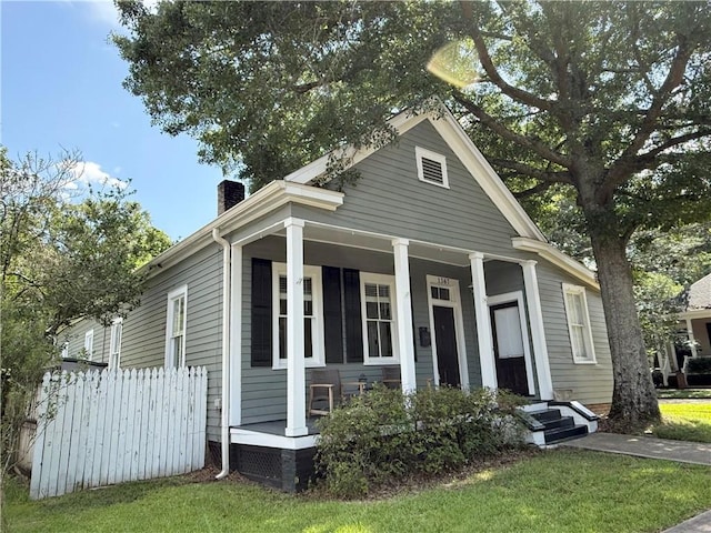 1367 Brown St, Mobile, AL 36604 - view of front of house with covered porch, a chimney, and a front lawn