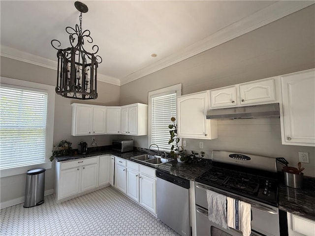 1367 Brown St, Mobile, AL 36604 - kitchen with stainless steel appliances, a chandelier, under cabinet range hood, crown molding, and white cabinetry