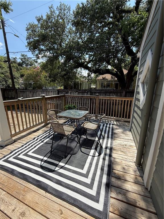 1367 Brown St, Mobile, AL 36604 - deck with a fenced backyard and outdoor dining area