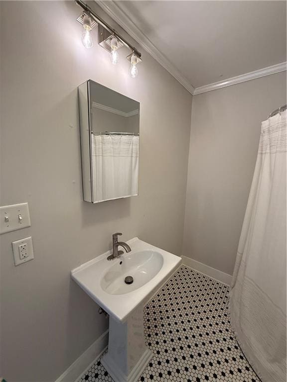 1367 Brown St, Mobile, AL 36604 - bathroom featuring a sink and ornamental molding