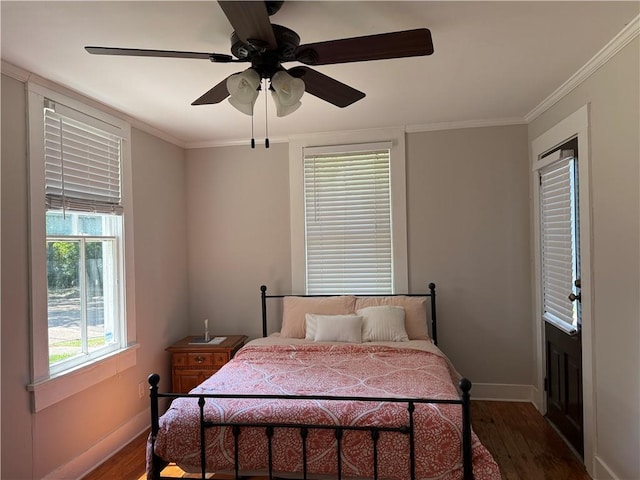 1367 Brown St, Mobile, AL 36604 - bedroom with dark wood-style floors, ornamental molding, and a ceiling fan