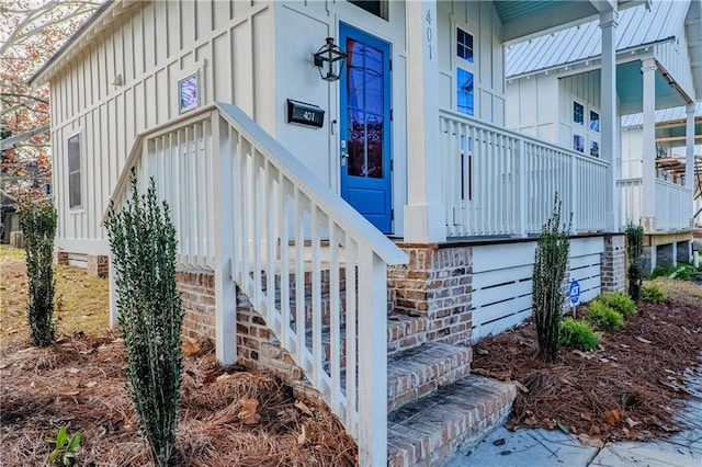 view of exterior entry with board and batten siding