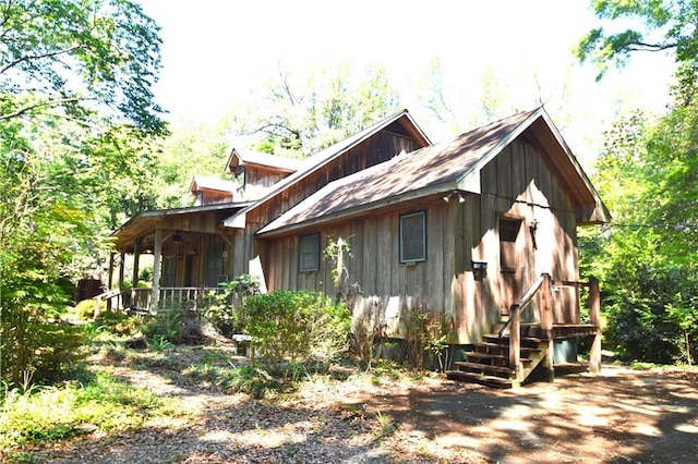 view of side of home with a porch